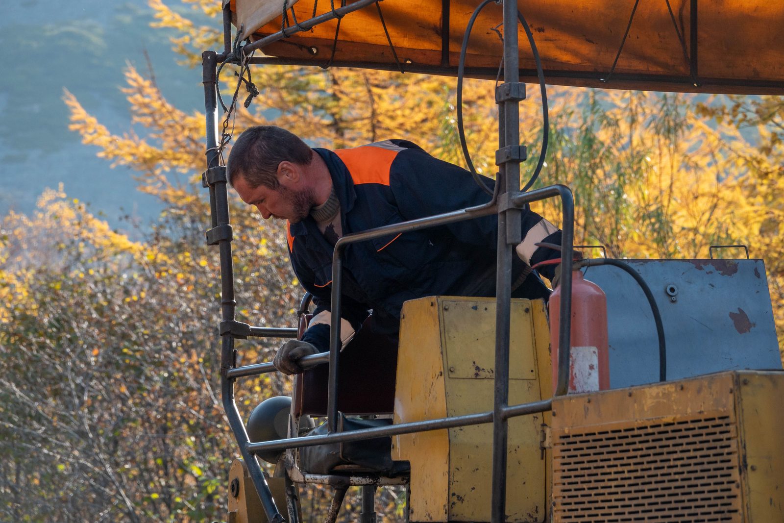 Operator at the controls of heavy construction machinery on a job site